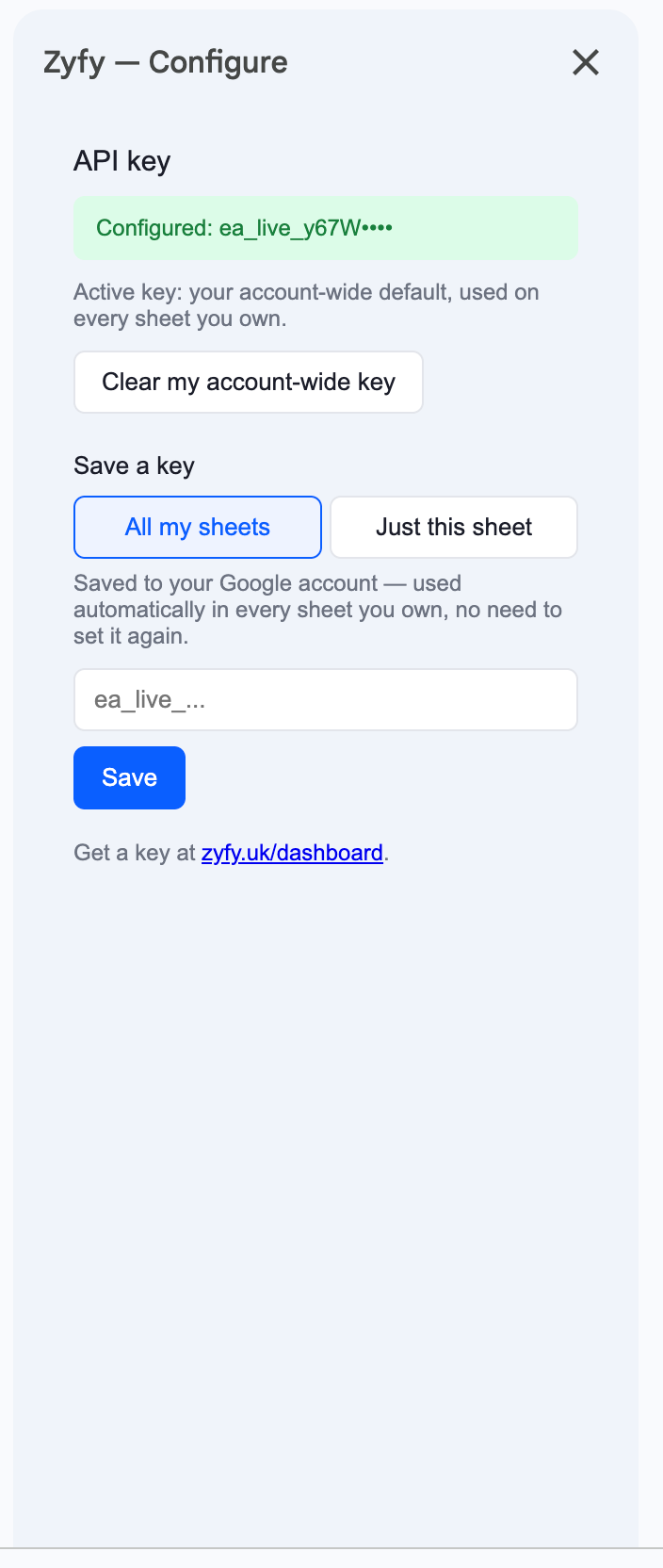 The Configure API key sidebar, showing the masked key, active scope, and the choice between saving it for all sheets or just this one